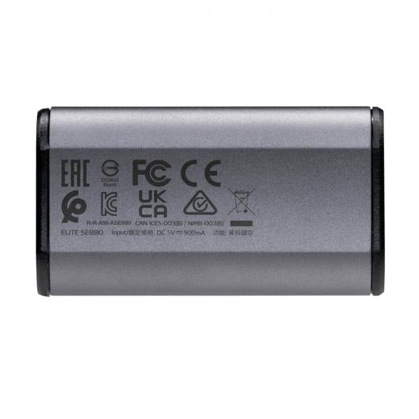 Compact silver IT power adapter with CE, FC, UKCA certifications, labeled ELITE SE880 for business tech use