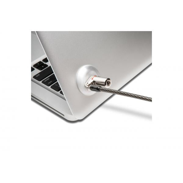 Laptop security cable lock attached to silver notebook, protecting IT hardware with anti-theft device