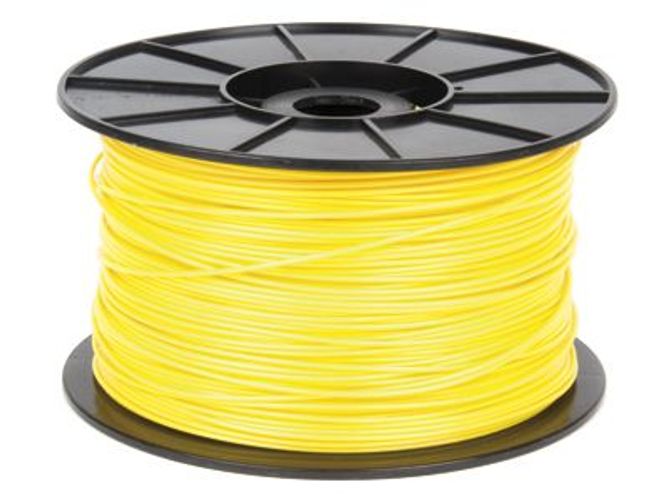 Bright yellow 3D printer filament spool on black reel, ideal for additive manufacturing projects.