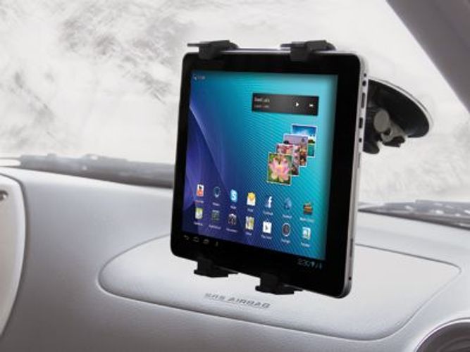 Tablet mounted on car dashboard with suction cup holder, displaying apps and media