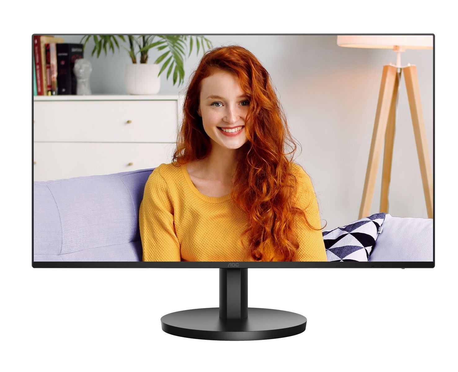 AOC monitor displaying woman with red hair on purple sofa, ideal for office or home use